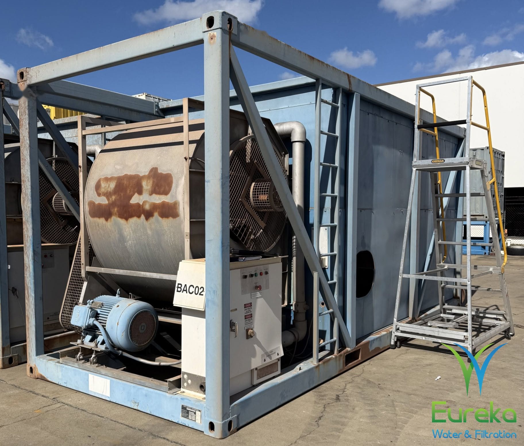 Portable cooling tower: portable containerised cooling tower before refurbishment, with rust on the fan housing